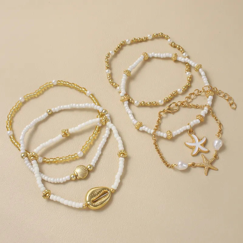 Sommerliches Armband-Set ⎜ Muschel- und Seesternmotive für lässige Looks mit maritimer Note