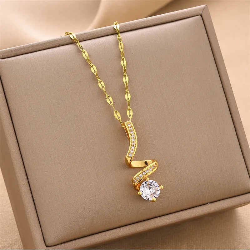 Zarte Damenkette mit Anhänger ⎜ Goldene Kette mit geschwungenem Anhänger und funkelndem Stein für elegante Anlässe