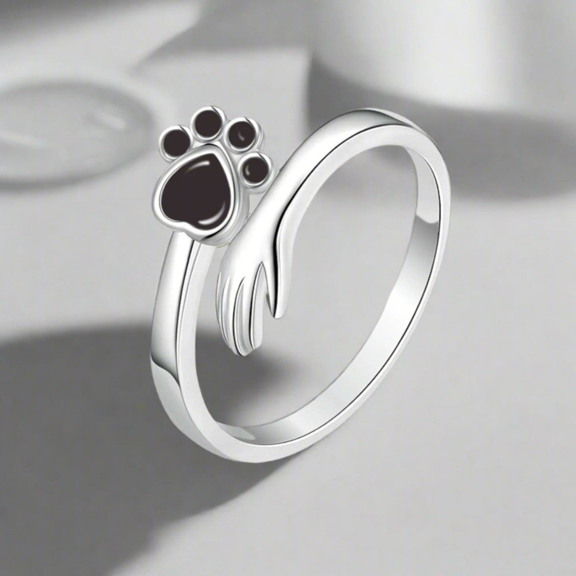 Silberring mit Katzenpfote ⎜ Verstellbarer Damenring mit niedlichem Pfoten-Design und funkelndem Zirkonia