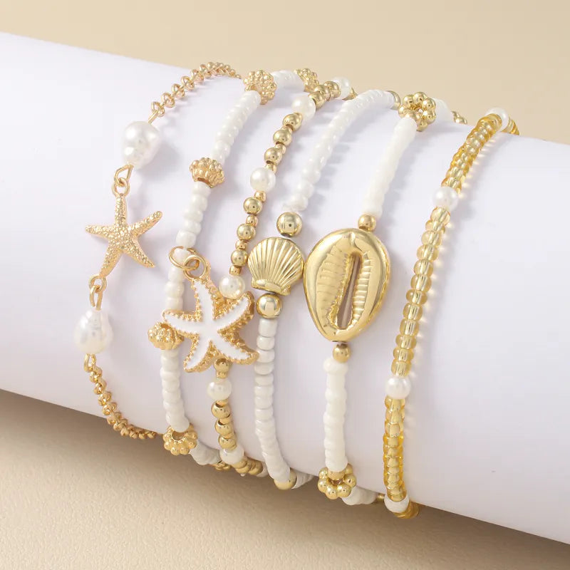 Sommerliches Armband-Set ⎜ Muschel- und Seesternmotive für lässige Looks mit maritimer Note