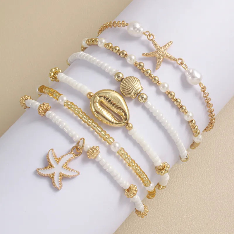 Sommerliches Armband-Set ⎜ Muschel- und Seesternmotive für lässige Looks mit maritimer Note