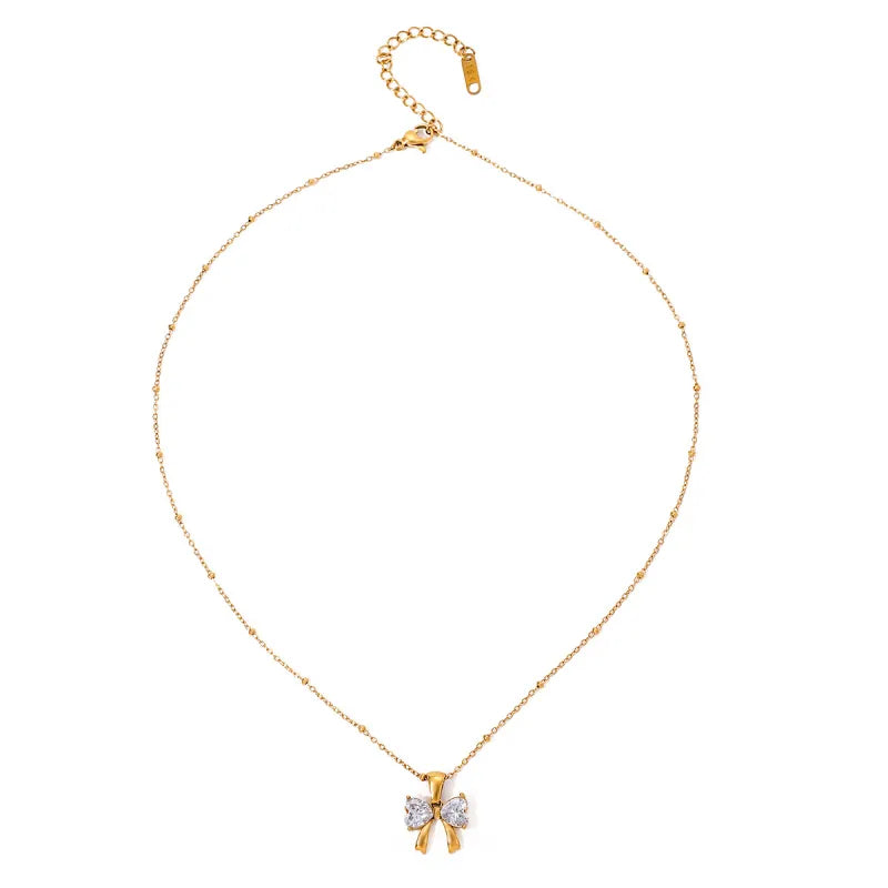 Kette mit Schleifenanhänger ⎜ Vergoldete Edelstahlkette mit funkelndem Zirkonia für feminine und elegante Looks