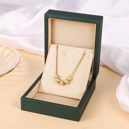 Halskette für Damen ⎜ Vergoldete Kette mit glänzenden Kugelanhängern für stilvolle Alltags- und Business-Looks