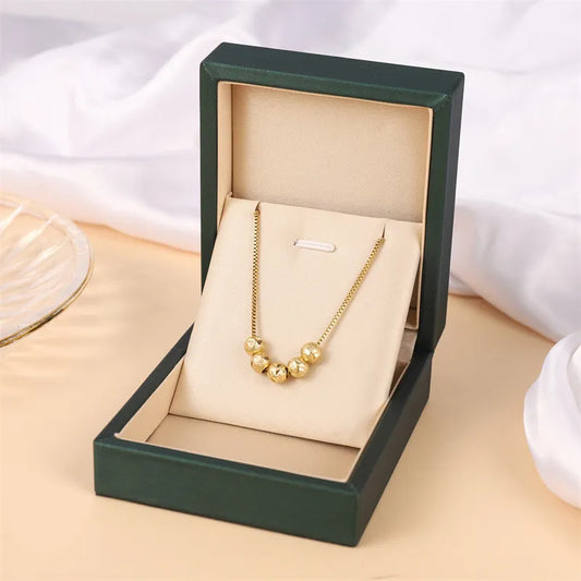 Halskette für Damen ⎜ Vergoldete Kette mit glänzenden Kugelanhängern für stilvolle Alltags- und Business-Looks