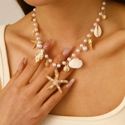 Schmuck-Set für Damen ⎜ Kette und Armband mit Muscheln, Perlen und Seesternen für sommerliche Strandlooks