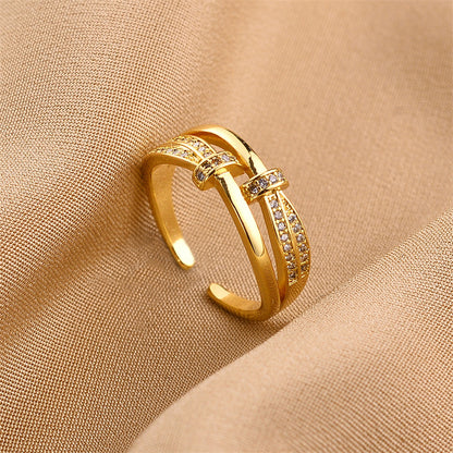 Ring in Goldoptik mit Zirkonia ⎜ Verstellbarer Bandring mit elegantem Schleifen-Design für stilvolle Auftritte