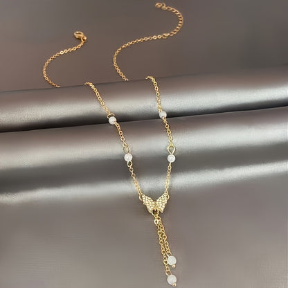 Halskette für Damen ⎜ Verspielte Kette mit Perlen und funkelndem Schmetterlingsanhänger für elegante Alltagslooks