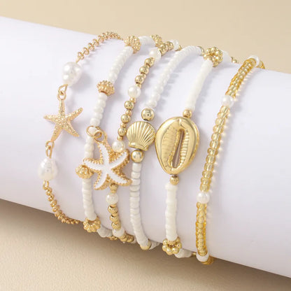 Sommerliches Armband-Set ⎜ Muschel- und Seesternmotive für lässige Looks mit maritimer Note