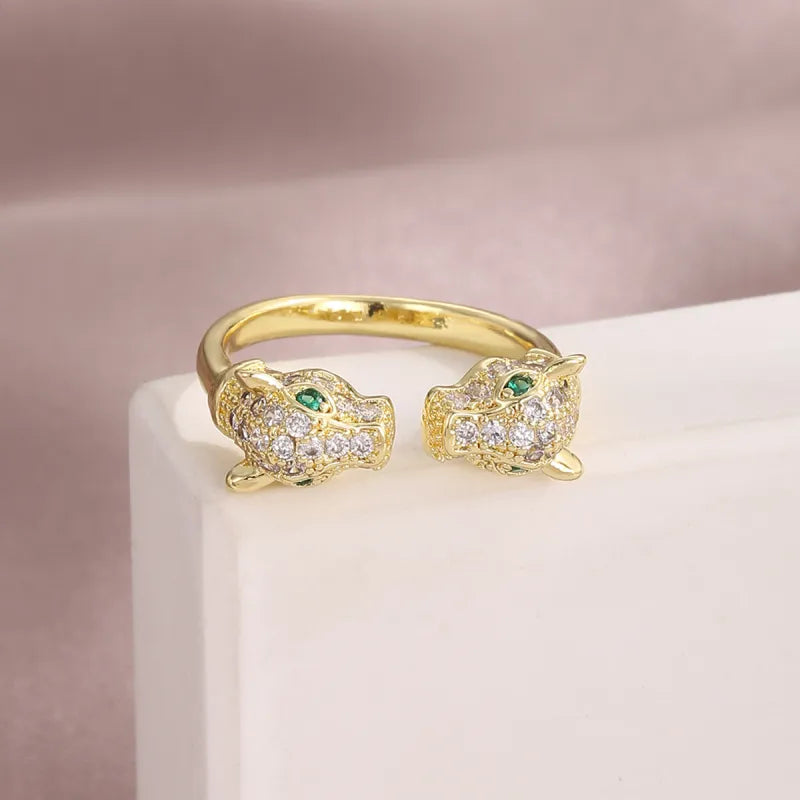 Tigerköpfen-Ring in Goldoptik ⎜ Offenes Design mit grünen Augen und Zirkonia für ausdrucksstarke Looks