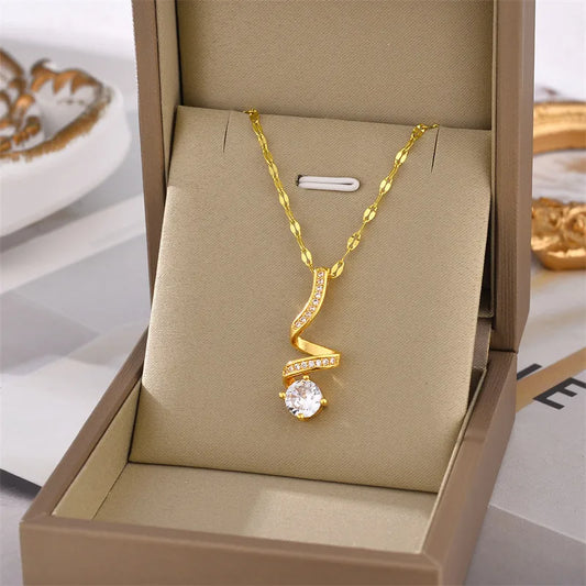 Zarte Damenkette mit Anhänger  ⎜ Goldene Kette mit geschwungenem Anhänger und funkelndem Stein für elegante Anlässe