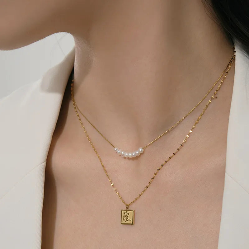 Ketten-Set für Damen ⎜ Filigrane Doppelhalskette mit Perlen und Blumenanhänger für elegante Alltagslooks